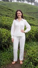 Full length styled view of Sunavyaa white crush cotton co-ord set with puff sleeves and narrow pants