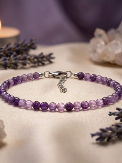Sunavyaa amethyst crystal anklet flat lay with raw amethyst stone on white plaster surface